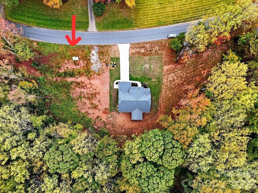 Great Location on this ready to build on 1.65 acre wooded lot with creek frontage. Parcel is graded and cleared with septic permit in hand. High capacity constant pressure well system installed with adequate volume to maintain an irrigation system. Located in desireable "Belwood Subdivision".