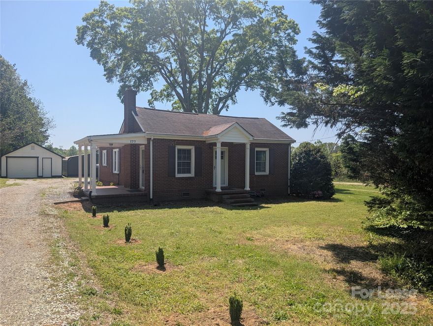 Welcome to this fully updated RANCH home! This 2 bedroom includes brand new LVP flooring and freshly painted throughout. The Living/Dining space offers plenty of space and natural lighting while the Kitchen to the right showcases a beautiful cabinet layout. Down the hallway is the remodeled Bathroom and both Bedrooms, with the Primary Bedroom coming with an ensuite Half Bathroom. Towards the back, there’s a converted porch/Mudroom that includes the laundry hookups. The detached garage/carport duo is found outside, offering plenty of storage and/or parking space. Lastly, be sure to take advantage of the beautiful landscaping. Be advised, the outbuilding and back half of the lot behind the garage is NOT included for Tenant use. Fireplace for decorative use only. No smoking and no pets allowed.