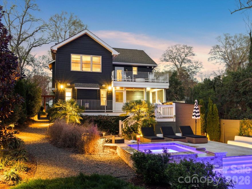 Resort-Style Private Retreat Minutes from Uptown Charlotte
Discover a rare offering—an exceptional custom-built residence that delivers modern sophistication, luxurious outdoor living, and unmatched privacy, all while being just moments from Uptown, NoDa, and Plaza Midwood. Surrounded by mature trees and set back from the street, this home provides a secluded, resort-like atmosphere in one of Charlotte’s most desirable urban locations. Designed with intention and crafted with premium finishes, this fully upgraded smart home blends everyday comfort with high-end living. Thoughtful technology, designer selections, and a spacious, flowing layout make the home ideal for both relaxed living and effortless entertaining. The outdoor spaces are truly standout features. A heated and chilled saltwater pool with integrated spa and waterfall creates a stunning focal point, complemented by expansive terraces, multiple outdoor living areas, a screened porch, Trex deck, and beautifully landscaped grounds with custom lighting. A dedicated pool bath with shower adds year-round convenience. Inside, the main level offers an entertainer’s kitchen with granite countertops, a wet bar with beverage refrigerator, a large dining area, and a warm, inviting great room with fireplace. A first-floor bedroom and private office provide flexible living options. Whole-home smart surround sound enhances both daily living and hosting. Upstairs, the luxurious primary suite includes a custom walk-in closet and a private terrace—perfect for morning coffee or unwinding at sunset. This level also features a kitchenette, spacious laundry room, and two additional bedrooms. A rare combination of privacy, design, and location, this home lives like a personal resort in the heart of Charlotte.