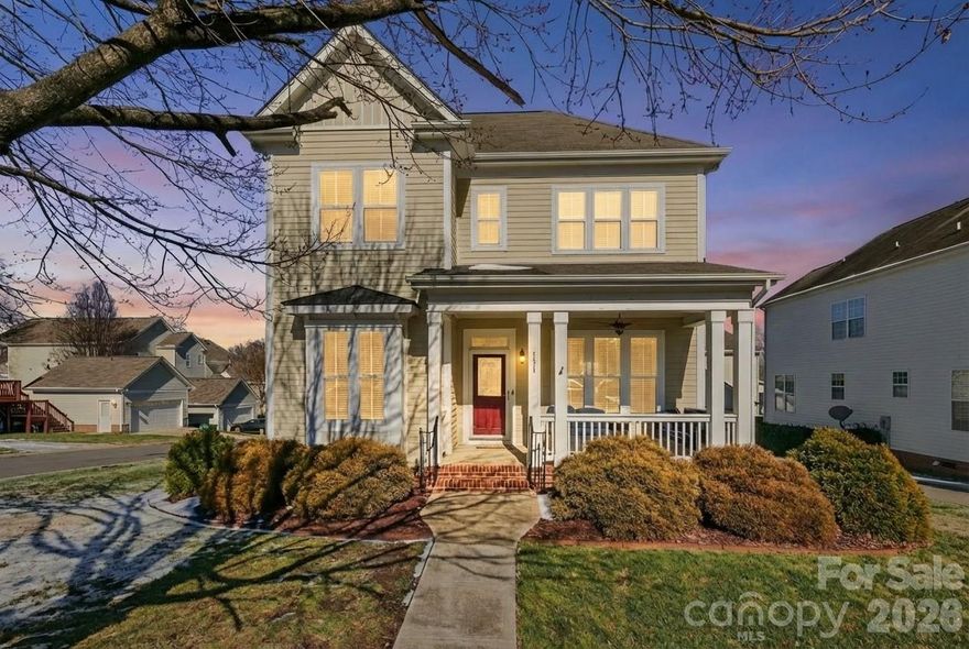 The McAdenville Marvel! Take advantage of a rare opportunity to buy McAdenville Village with this Christmas Town USA stunner. Inside you'll find a massive primary suite on main with immaculate hardwood floors. Gas log fire place with blower completes the living room where you'll head to the formal dining room and kitchen to complete the first floor. Upstairs you'll find another 3 bedrooms and 2 full bathrooms, each en suite bathroom includes custom upgrades such as ceiling heater! Enjoy the view of the lake from the upstairs windows! Outback you'll find an oversize garage with loft for all of your Christmas storage as well as bonus concrete pad for parking. Backyard has been fenced in and equipped with surround sound system and entertaining pergola. Add that this is a corner unit and BOOM... You have the hottest listing in McAdenville! Come and see it today before somebody else will because you know folks have been lined up to move back to Christmas Town for years!