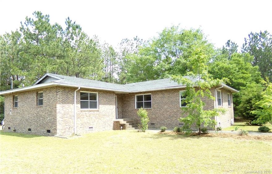 REDUCED!! Make this spacious house, located on an attractive lot, your home.  It features a kitchen/laundry, open concept living room/den/dining area that leads to the large master bedroom and bathroom.  The two other bedrooms have easy access to the full hall bathroom.  With your own update/renovation ideas, this could be the home you have been looking for.