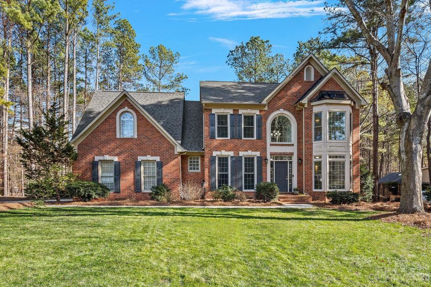 Stunning brick home nestled within the Harbour, a coveted waterfront community. Experience Lake Norman living with a deeded boatslip w/lift, located in a prime spot. Boasting three bedrooms, two flex suites and three full baths, this property is beautifully updated and move-in ready. Step inside the two-story foyer to modern flooring and fresh paint. Bathed in natural light, each room breathes a bright, airy feel. The main level offers a flex suite w/ adjoining remodeled full bath. A great room with gas/wood fireplace flows seamlessly to the breakfast area and Chef’s kitchen with new double ovens, expansive island and scullery/pantry - perfect for hosting. Upstairs the primary suite provides a tranquil retreat and modern spa-like bath, while additional bedrooms offer versatility. Discover the private, tree-lined fenced yard, expansive deck, firepit and path that leads directly to community amenities and your boat! New Windows, Water Filtration System, Encapsulated Crawlspace and more!