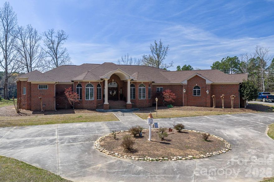 20.22 acres w/ 3 BR, 3 1/2 bath home just 6 minutes to downtown KM, 4 min. to 74 bypass and then I-85, 12 minutes to Two Kings Casino, 5 minutes to Moss Lake and 10 minutes to Shelby (Cleveland Mall and Cleveland Community College).  Outside there is a 2400 sq ft building, 1800 sq ft is pre-plumbed for bath, washer, dryer and kitchen.  720 sq ft with finished office, bathroom with shower, 480 sq ft is unfinished part.  Kitchen has granite, pull out drwaers, pantry and plenty of storage with cabinets.  Subzero refridgerator, thermador gas cooktop, 2 Thermadore ovens, trash compactor, dishwaser and microwave complete the kitchen.  Bathrooms have granite.  Veranda at back of house runs the length of the house.