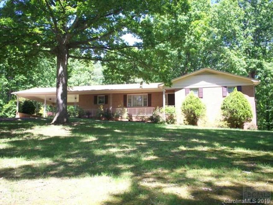 Secluded Brick Ranch Home sitting on over 4.5 acres. Home Features 3BR/2BA, Formal Living Room, Dining Room, and Den with Fireplace. Full Unfinished Basement with extra garage door. DBL Attached Carport. Dbl Detached Garage with storage. Large shade trees with a private back yard. Zoning is Rutherford College ETJ. No City Taxes!