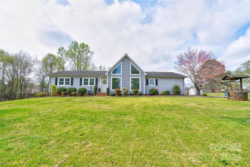 Come see this 3 bedroom 2 bath home located in a quiet neighborhood on a large lot.  This open floor plan home is a must see and has many features that include granite countertops, windows, vinyl plank flooring, back splash, updated kitchen, encapsulated crawl space, gas logs, and so much more.  Spacious primary bedroom. Appliances to remain with the property.  Back deck offers plenty of space to enjoy grilling, relaxing or having a gathering.  Large fenced in back yard.  Home is move-in ready!