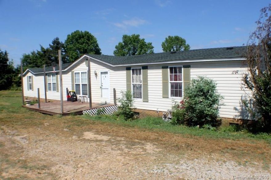 Country living at its best! 2200+ sq ft waterfront, private retreat w/6.75 acres, 4 stall barn w/tack room & pastures for your horses. Enjoy the tranquility of waterfront living while relaxing on the lg deck or entertaining at your above-ground swimming pool. This home features 4 BR & 2 BA, lg open kitchen & gas log FP for cozy winter evenings. Split BR floor plan w/lg MB, MBA boasting double vanities, garden tub and a sep shower. All of this in the highly sought after Buford School District.