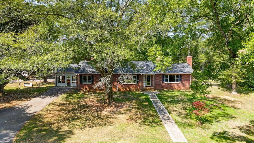 Welcome to this stunning all-brick ranch featuring three bedrooms, two bathrooms, set on a sprawling 10-acres. The long driveway ensures privacy, while the expansive grounds offer endless possibilities for creating your own outdoor experiences. Partially fenced yard perfect for play & entertaining. The home has an updated kitchen with stunning quartz countertops, appliance garage, soft close doors, & pull outs for your pots and pans. The Flex duo gas range has the ability to cook multiple temps at once. Central Vacuum for whole house cleaning. The home has ample storage and natural light, as well as a screened porch perfect for relaxation. There is a full basement for all your storage needs. Additionally, the three-car garage with a built-in workshop and a large concrete covered patio, perfect for parking your RV, a hobbyist dream. This private estate is your perfect oasis. HVAC/Roof about 3 years, new hot water tank, & encapsulated crawlspace. Don’t delay schedule your visit today!