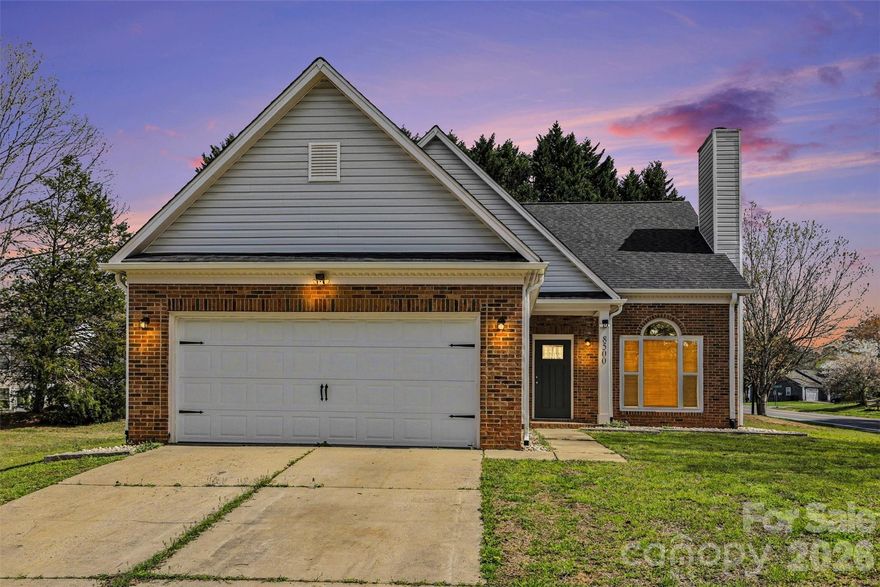 Welcome to this beautifully maintained home in Woodhill Manor! You're welcomed by an inviting family room featuring a vaulted ceiling, cozy wood-burning fireplace, and large windows that fill the space with natural light. The formal dining room showcases a tray ceiling and a sliding glass door that opens to a newer, extended patio—perfect for entertaining. The kitchen features white shaker cabinetry, granite countertops, stainless steel appliances, a newer refrigerator, and a ceiling fan, along with a bright breakfast nook that offers plenty of natural light. The primary suite is conveniently located on the main level and includes a spacious, remodeled en suite bath with dual vanities and linen shelves, along with a generous walk-in closet with custom organizers. The laundry room is just off the two-car garage for added convenience. Upstairs, you'll find two additional bedrooms and a versatile space that can serve as a fourth bedroom, office, or flex area. A shared bathroom with dual vanities and a tub/shower combination completes the upper level. Professionally installed blinds are featured throughout the entire home. Situated on a corner lot, the home also offers a fenced backyard complete with a shed, patio and pergola. Fresh soil has been added to the yard, and new decorative stones accent the perimeter of the home. Conveniently located near major highways, including I-485 and I-85, offering easy access to the greater Charlotte metro area.