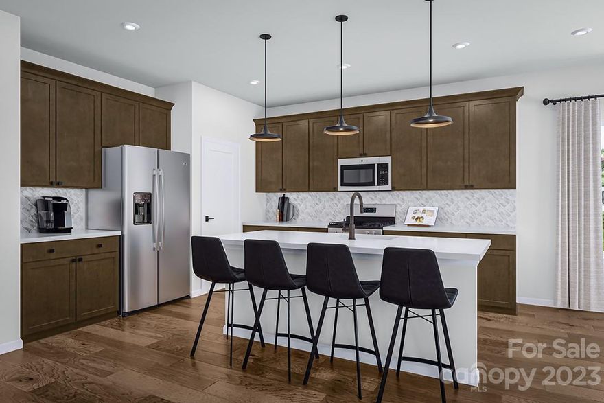 Beautiful January Move-in Home for Sale in the brand new Tri Pointe Homes community, Alton Creek, located in the heart of Mint Hill, NC. 

This home, the Banks plan, features a variety of upgrades including a Gourmet Kitchen w/ 36" Gas Cooktop, 36" Gas Fireplace, 6' Sliding Glass Door in Dining Room Connecting to an Extended 12' x 10' Covered Outdoor Living Space, Mariner Oak Hardwood Floors across entire first floor, Upgraded Home Office w/ Added Lower Cabinets and French Door, Upgraded Staircase w/ Open Rail Metal Balusters on First floor and Oak Box Steps, Upgraded Laundry w/ Added Door, Added Windows in Primary Suite and Dining Room, Added Drop Zone off Garage, Tankless Gas Hot Water Heater and 220 Volt 50 AMP EV Pre-Wire Outlet in Garage.