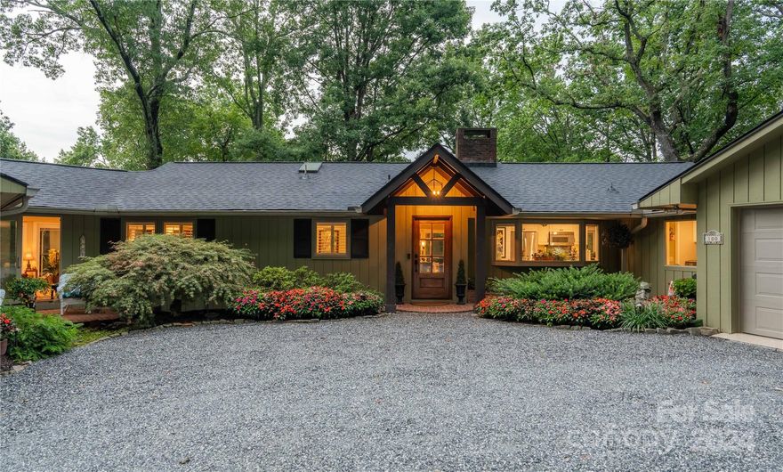 Nestled in Tryon, NC, 100 Stone Circle Drive is a beautifully renovated home blending rustic charm with modern luxury across 3,725 sq. ft. Features include a living room with mountain views, exposed brick, and three fireplaces. The luxe primary suite offers tray ceilings, dual vanities, a walk-in shower, and dual closets. The lower level has a guest suite and den with exterior entrance. Outdoors, enjoy a deck with a pergola, an outdoor fireplace, and manicured landscaping on 1.78 acres. A separate studio/man cave provides a serene retreat. Located near Harmon Field Park, downtown Tryon, and scenic mountain drives, it's 45 minutes from Asheville & Greenville. $450,000 in renovations since 2015 include a new roof, HVACs, master and guest suites, an expansive deck, Pella windows, and more. Additional features: whole house generator, security system, irrigation, low voltage lighting, and heated/cooled garage. View could easily be expanded. Stunning, manicured gardens and paths throughout.