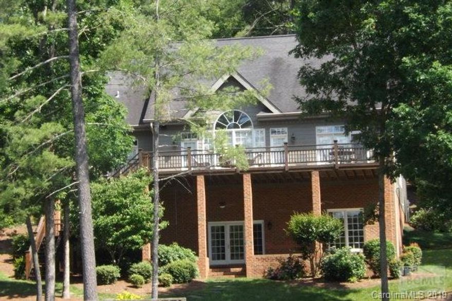 NEW LOWER PRICE AT LAKE JAMES!! Beautiful Lake Front home on Lake James, panoramic lake views from almost every room in this home.  Easy walk from home to the covered dock with diving board, fish at your leisure, enjoy sunning and entertaining on your second story dock. Large master suite on first floor overlooking the lake. Two more bedrooms on main level, large bonus room over attached two car garage. Two bedrooms and full bath in finished basement with its own kitchen. Great for weekend visiters! This is lake living at its best, close to Morganton for shopping. Come enjoy boating on Lake James this summer!!