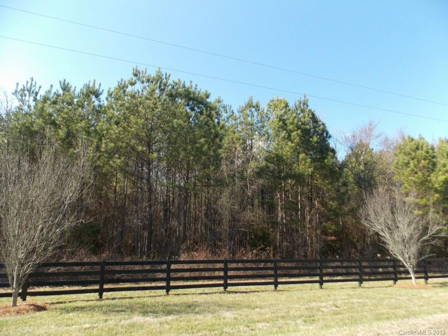 This beautiful 6 +/- acres  is lined across the front with black 4-board black equestrian style fence and Purple Plum trees. Enjoy quiet county living yet minutes from many attractions: Downtown Historic York, Bratttonsville, and Lake Wylie. Also just a short drive to downtown Rock Hill and the Galleria Mall.