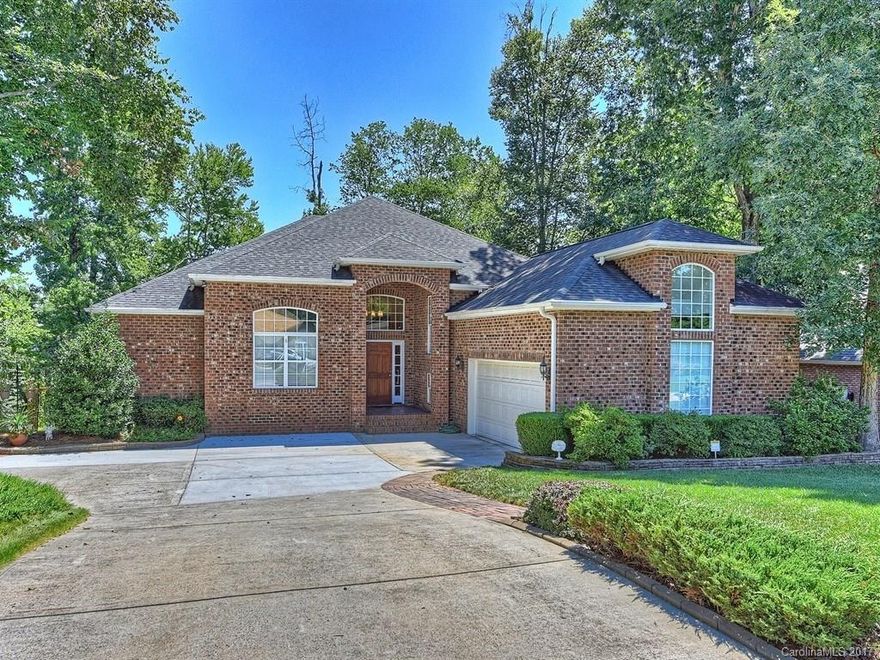 Be first in line to view this STUNNING all Brick Ranch with lower level living quarters. Think Man Cave, Football, Billiards, Exercise etc...in this custom finished lower level featuring Pergo laminate floors, kitchenette equipped with bar, sink & mini fridge. Master Suite on main level!! You will LOVE the hardwood floors, granite counters, double sided stone fireplace, soaring ceilings and archways, small very low maintenance yard & lot. This home has ALL the wants & needs!!!