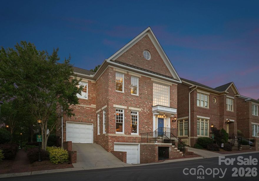 Situated in the heart of Dilworth, this end-unit townhouse offers an exceptional opportunity within one of the neighborhood's most coveted and walkable enclaves. Originally reimagined by designer Scott Carpenter, the home spans four levels with soaring ceilings, an open iron staircase, and an incredible backyard patio. 

A grand two-story foyer welcomes you inside, leading to the fully updated, showstopping speakeasy lounge, complete with custom display shelving, stylish wallpaper, and elegant lighting. The chef's kitchen features a stainless steel appliance suite, stone countertops, and barstool seating. A dramatic three-story dining area and a living room anchored by a gas fireplace, wet bar, and built-in cabinetry complete the main level, with seamless access to the backyard.

Upstairs, the primary suite offers custom wood-paneled walls, a private balcony, and a spa-inspired bath with sauna shower, and a custom built-in open closet area. Two additional ensuite guest bedrooms provide well-appointed accommodations, each with ensuite bathrooms, custom closet systems, and high-end finishes throughout. 

The lower level features a fourth bedroom, a full bath, and a private home theater with a 70" television and theater chairs. Additional areas include a dedicated fitness room, two garages, and a spacious attic on the fourth level.

The outdoor living experience is truly exceptional. A fully fenced and gated stone patio with professional hardscaping and landscaping creates a private sanctuary designed for year-round enjoyment. The built-in Lynx grill station is ideal for alfresco dining, while a serene pond with an integrated water fountain adds a tranquil ambiance. Gather around the gas fire feature lounge area on cool evenings, or stay cool in the warmer months with the dedicated cooling and misting fan.

Ideally positioned just minutes from Uptown Charlotte, South End, and Midtown, this home offers effortless access to the city's top dining, boutique retail, and major roadways. Families will appreciate proximity to some of the area's most sought-after public and private schools, making this a rare offering that delivers on both lifestyle and location.