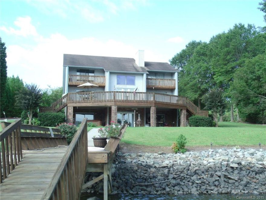 Beautiful Waterfront Home w/.93AC on High Rock Lake, 2nd largest lake in NC. 4 bedrs, 4 baths, 2 car. Finished lower level w/bedroom, full bath, living rm & 2nd full kitchen w/granite. Master on main & master up.Balconys on both upper bedrooms, large deck on main. Vaulted greatrm w/tons of light and lake views. Wood floors, cathedral ceilings, upper & lower decks. Every bedroom has large walk-in closets. Private dock & pier. Grandfathered private boat ramp. 170' Water Frontage