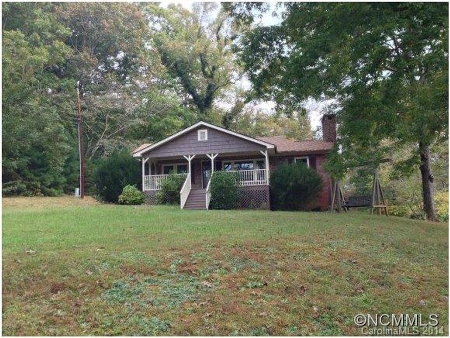 Sweet two bedroom cottage on a one acre lot, updated kitchen and bath, wood stove, large deck (550 sq.ft.), covered front porch, outbuildings and a mountain view.  Conveniently located to both Columbus and Tryon, it's an excellent value for a starter or retirement home.