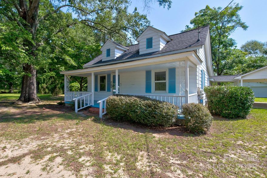 Charming Farmhouse on 25 Acres with Workshop & In-Law Suite!  Welcome to 4070 Timrod Road — a unique opportunity to own a spacious home with beautiful acreage and room to make it your own! This farmhouse offers a 700 sq ft in-law suite.   Major systems have already been updated: roof (2020), HVAC (2020), hot water heater (2020), updated plumbing, and a clear CL-100 for peace of mind. While the interior needs cosmetic updates, the home has great bones and endless potential.  Outside, you’ll find 25 acres of mostly wooded land, a 24x24 wired workshop with concrete floor, and a variety of mature trees including pecan, plum, fig, black walnut, and a scuppernong vine. Property is on a private well, has gas heat, and septic tank pumped in 2018.  Whether you're looking to start a mini farm, create a family homestead, or invest in a property with income-producing potential, this one has it all!