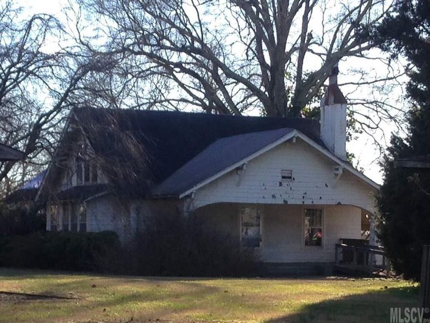 PRICED TO SELL!  AT MORE THAN 1/2 THE TAX VALUE!  Home has been used as a school since 1985, many walls were taken down on the main floor. Upstairs has small apartment with kitchen and bath. Outside stairs should not be used. Lots of possibilities, beautiful lot 1.2 acres. Additional structure offers 150 heated sq. ft with 1/2 bath that could be used as workshop, craft room etc. Sold as is, no repairs will be made.