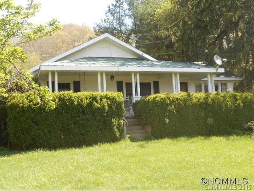 Use your imagination and a little TLC to make this convenient mini-farm your very own sanctuary. 2 acres with outbuildings and barn. Almost all the land us useable. Lots of garden space. Located in Ratcliffe Cove and only about 10 minutes to Main Street Waynesville. Easy to get to shopping, schools and medical. Home features large eat in kitchen and 3 bedrooms. Large covered porch and workshop area. Also has a generator if needed.