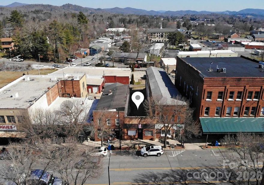 Rare opportunity to own a premier commercial lot in the heart of downtown Brevard. Located at 46 W Main Street, this ±0.20-acre property offers exceptional visibility and positioning along one of the most desirable corridors in town. The existing storefront façade remains, while the former structure has been removed—providing a clean slate for your vision. With room to construct approximately 2,600–2,800 square feet, this site is ideally suited for retail, restaurant, boutique office, gallery space, or mixed-use potential (subject to city approval). Positioned on bustling West Main Street, the property benefits from heavy daytime foot traffic, strong surrounding businesses, and consistent tourist flow. Downtown Brevard is known for its vibrant arts scene, thriving local businesses, and proximity to Pisgah National Forest—drawing visitors year-round. Opportunities to build new construction in this highly sought-after downtown location are extremely limited. Bring your architect and capitalize on the growth and energy of downtown Brevard.