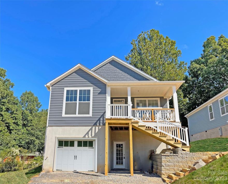 Rare long range mountain views in this newly constructed, 3-bedroom, 2-bath home that features a gorgeous open concept kitchen-living-dining floor plan that was thoughtfully designed to appeal to all buyers. The front porch will allow for relaxation while soaking in the mountain views! The kitchen boasts granite countertops, stainless steel appliances, and shaker-style cabinetry. The layout features a large island perfect for entertaining. The owner’s bedroom suite is a retreat of its own with a large shower, double vanity, and sizable walk-in closet. The lower level includes a garage and large unfinished bonus space that could be easily finished to become your studio guest apartment or workshop. The exterior is sided with ColorPlus by Hardie and finished with craftsman decorative details. The property is ideally located 1.5 miles from downtown Black Mountain and 15 minutes to Asheville. This home is part of the brand-new Padgett Place neighborhood quickly becoming one of WNC's best.