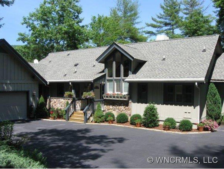 Absolutely FLAT lakefront property. Park like setting,impeccably landscaped with native foliage and annual flowering plants and bushes. Listen to peaceful sounds of a recirculating waterfall and fountain. Loads of room with the master suite and living areas on the main floor with duplicate living space on the lower level complete with F/P and guest kitchen plus an upper level B/R and bath.