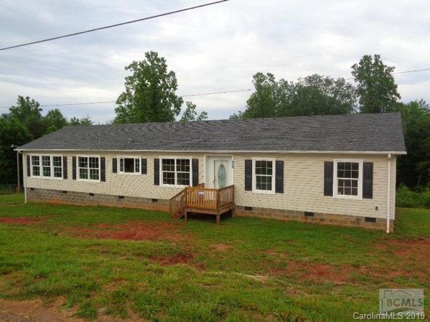 BETTER THAN NEW 4 bedroom 2 bath home with over 2000 sq ft all on 1 single level. Home is in move-in condition and just underwent a beautiful remodel, including new hardwood flooring, interior doors, lighting, toilets, and fresh interior paint. A HUGE open concept living/dining area greets you as you walk thru the front door.  The room spans from the front to the rear of the home and boasts new wide plank hardwood flooring, stone faced wood burning fireplace, and sliding glass doors that lead to the rear deck. The kitchen is a dream come true with cabinets everywhere you turn, multi level countertops, chefs island, pantry, and dining area. Adjacent to kitchen is the bonus room and laundry room. The master site is centrally located in the home and boasts hardwood flooring, crown moulding, and a private bath complete with soaking tub, walk-in shower, water closet, make-up station, and a walk-in closet. Just off the living room are the 3 other bedrooms with a centrally located full bathro