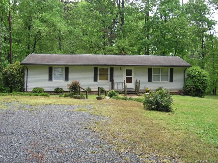 Great basement home with over 2500 total sq. ft. Walk out basement could easily be heated but does currently have a woodstove. Ton's of possibilities. New laminate flooring installed throughout main level. 30x22 detached wired shop with a 15x29 carport on the side and a 14x23 concrete pad in front. Plenty of room to work on vehicles. 12x23 rear deck with built in seating and a 12x35 patio with a fire pit area. Very private country living but min's from Charlotte, Mt. Island, Huntersville.