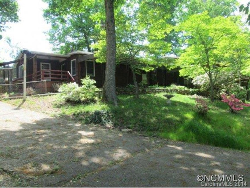 Investor Alert! Expanded single wide mobile with additions, covered porches and expansive views. Great property with solid rental history on large lot that can be divided. MBR addition with walk in closet and private deck. Possible small 4th bedroom or office. Owner is licensed NC Real Estate Broker. Owner will consider financing with substantial down payment and other terms. Great opportunity for small development.