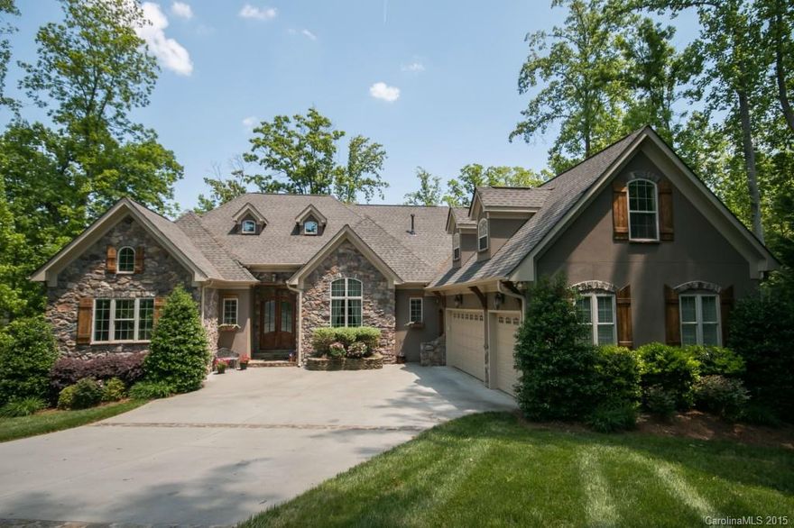 If casual elegance describes your perfect lake home...you have found it! 250 feet of Lake Norman shoreline brings privacy & serenity. Natural beauty surrounds you as you relax on your covered veranda overlooking the lake. Attention to details and quality craftsmanship throughout; barrel ceiling in dining room, custom cabinetry & large bonus room. The rec room features a bar area, stone fireplace & other exceptional details which make you feel as if you are on vacation playing pool or ping pong!