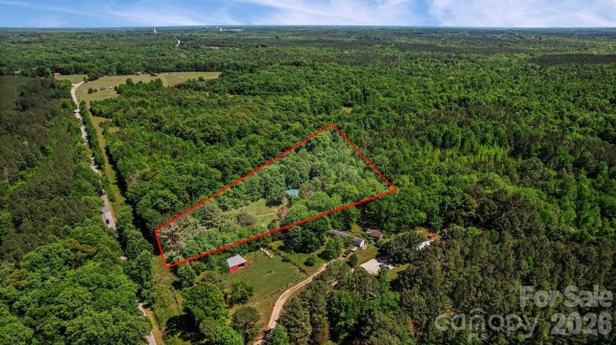 Discover the perfect blend of privacy and convenience with this 4.28-acre tract on Old Richburg Highway. Tucked away and surrounded by nature, this property offers a peaceful, secluded setting just minutes from I-77, giving you easy access while still feeling miles away from it all.

Featuring a mix of wooded landscape and rolling terrain, this property offers abundant opportunities. Whether you’re dreaming of building your own private homesite, creating a weekend retreat, or setting up a small-scale equestrian space (buyer to verify), there’s room here to bring your vision to life.

Enjoy the freedom of land ownership with space to spread out, explore, and make it your own - without sacrificing proximity to major routes and nearby conveniences.

The property includes a mobile home, storage shed, and RV - all conveying at no value and as-is.