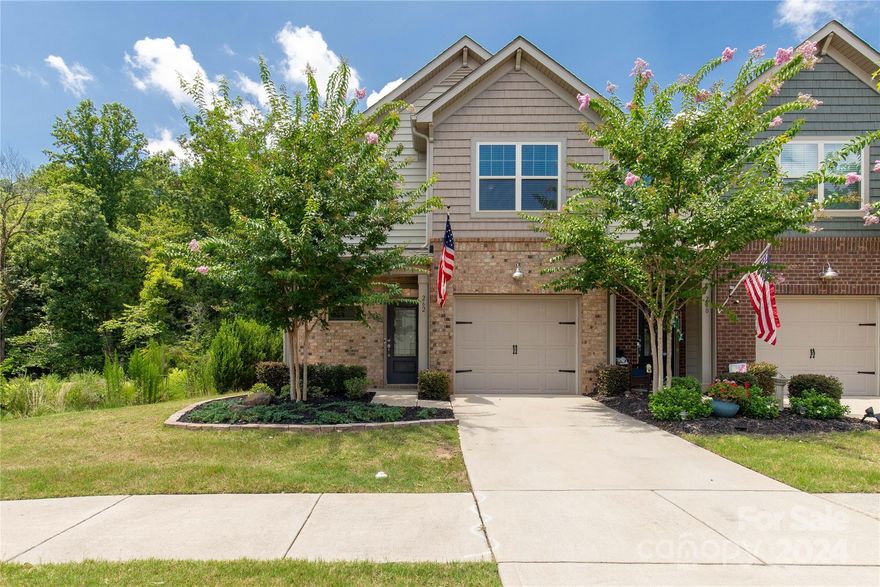 This gorgeous end-unit townhome in the desirable Waterside at The Catawba community has lots of wow! The open floor plan features faux wood laminate plank flooring on the main level and custom paneling in the entry hall. The kitchen boasts stainless steel appliances, a gas range, and granite countertops. The living room, located at the rear of the home, includes a custom shiplap fireplace with a reclaimed wood mantle.
Upstairs, the carpets have been freshly shampooed. The primary bedroom features a tray ceiling and a large walk-in closet. The primary bath is equipped with dual vanities, a soaking tub, and a separate shower.
Additionally, the home is equipped with a whole house water filtration unit and smart home technology for added convenience and efficiency.
Enjoy peace and quiet on the rear patio, which backs to woods for total privacy.