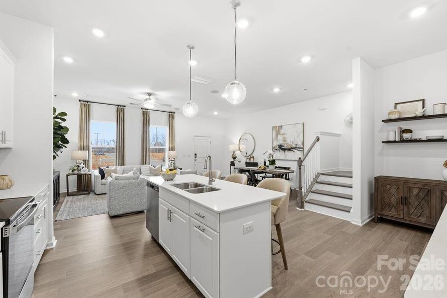 What's Special: Loft | Extra Garage Storage | White Cabinets. 
New Construction - Ready Now! Built by America's Most Trusted Homebuilder. Welcome to the Aspen at 5505 Wolfpack Alley in Terraces at the Exchange! This stylish new two-story townhome is designed for comfort and convenience. Step inside the welcoming foyer and discover an open layout where the great room, dining area, and kitchen flow seamlessly together, perfect for everyday living and entertaining. The kitchen shines with a center island and walk-in pantry, offering plenty of space for meal prep and storage. Just beyond the main living area, you’ll find a powder room and easy access to the garage. Upstairs, the inviting layout includes a versatile loft, ideal for game nights and a tech space. Two secondary bedrooms share a full bath, while the private primary suite features a spa-inspired en-suite bath and two walk-in closets for exceptional storage. A conveniently located laundry room completes the second floor. Residents will enjoy walkability to The Exchange, a brand-new development featuring Lowe’s Foods, Costco, Cold Stone Creamery, Club Pilates, Hollywood Feed, Halal Street Food, and more. Located off Highway 521, you’ll have easy access to I-485, I-77, and I-85. The area is thriving with nearby destinations like Swig and CrossRidge shopping center—home to Target and , and the Promenade at Carolina Reserve, offering T.J. Maxx, HomeGoods, Starbucks, Crumbl, and more. Plus, Charlotte Douglas International Airport is just 30 miles away, making travel a breeze. Additional Highlights Include: Quartz countertops and Revwood flooring. Photos are for representative purposes only. MLS#4317014