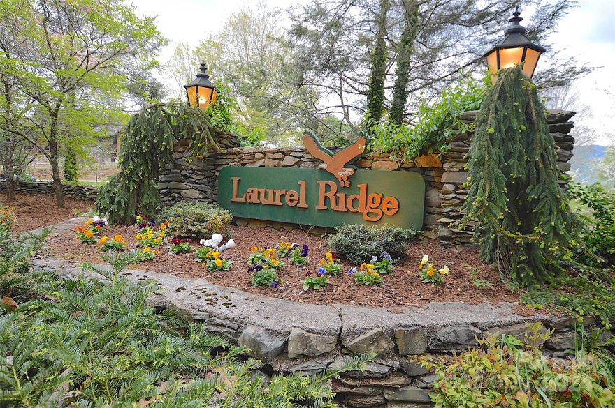 Under Contract - Mls can not accept the selling agent.  Rare Find in prestigious Laurel Ridge Country Club - 3.3 acres - Nothing like this on the market, waterfall view as you approach the 1st smaller building site, streams on both sides of the lot, Mountain and village VIEWS and 2 minutes to the golf course and clubhouse. 
Two Building sites to choose between: one near the creek and falls and the second is at the top of the lot. Land falls away to allow for a mountain view. No other homes in the view. View needs to be opened up.
Year round access.1800 square feet to build with a minimum of 1500 on one level. HOA dues are only $30/year.  CCRS are attached to MLS... and may reference building restrictions on the lot. City water and sewer are not installed. HOA info can be found on their website ask agent for the link...