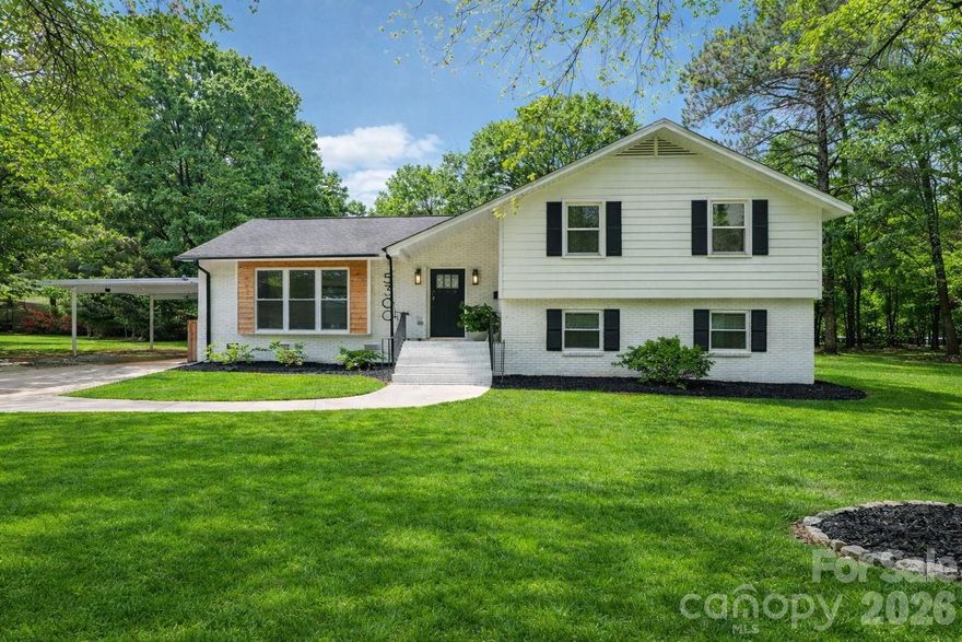 A thoughtfully renovated Windsor Park home designed for flexibility, featuring two primary suites and a layout that adapts to the way people live today. Just minutes from NoDa, Plaza Midwood, and Uptown, this bright four-bedroom home offers a rare combination of location, functionality, and modern updates. Originally renovated in 2023, the home blends clean, updated finishes with a layout that offers both connection and separation when needed. The main level is filled with natural light and open living spaces, complemented by hardwood floors and an updated kitchen that anchors the home. The lower level provides a true second living space with its own private entrance, bedroom, full kitchen, and living area, creating a comfortable and independent setup for guests, extended stays, or added flexibility. Set on a corner lot with mature trees, the property offers a sense of space and privacy that’s hard to find this close to the city. Ample parking and a large detached structure in the backyard add even more versatility, currently used as a gym and storage, and equipped with electricity, heating, and cooling, making it well suited for a workshop, garage, studio, or creative space. Located in one of Charlotte’s most established neighborhoods with easy access to Plaza Midwood, NoDa, and Uptown, this home offers a compelling combination of flexibility, function, and long-term value.