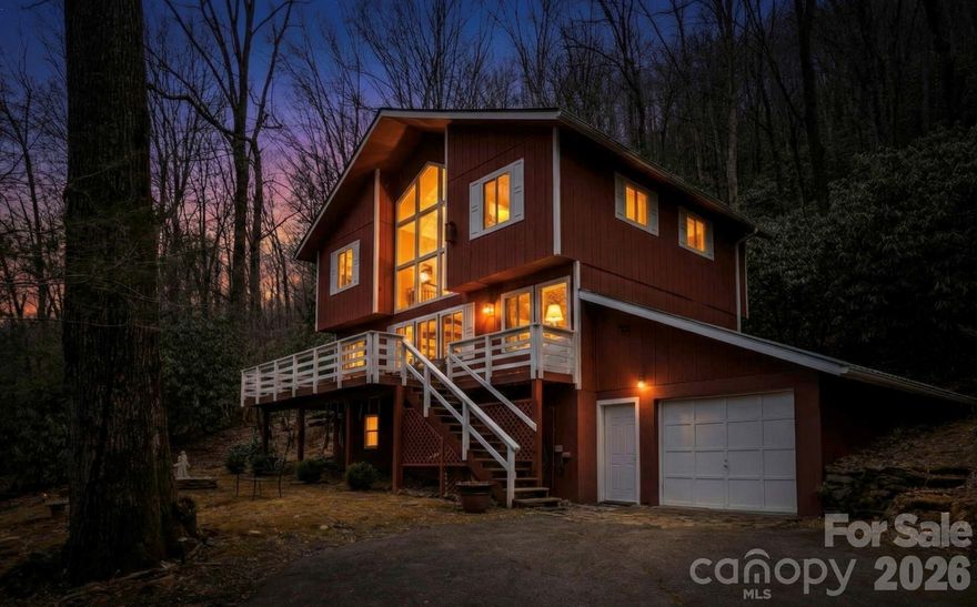 Experience the beauty of Western North Carolina mountain living in this stunning 3 bedroom, 3 bathroom home featuring cathedral ceilings, large windows, and breathtaking mountain views. The open living area is filled with natural light and perfectly frames the surrounding scenery.

Step onto the spacious porch overlooking the river, where you can relax with your morning coffee while enjoying the peaceful sound of flowing water and panoramic mountain views. With river access just steps away, this property is perfect for fishing enthusiasts and nature lovers.

The primary suite features a cozy fireplace with gas logs, creating a warm and inviting retreat. After a day of hiking or exploring the mountains, unwind in the basement sauna, adding a spa-like touch to this mountain getaway.

Located within walking distance to the United States Forest Service, outdoor enthusiasts will appreciate the easy access to hiking trails and endless outdoor recreation.

Being sold turnkey and fully furnished, this home is ideal for a full-time residence, second home, or short-term rental investment. Offering mountain views, river access, cathedral ceilings, and proximity to hiking and fishing, this property delivers the perfect blend of relaxation and adventure in the NC mountains.