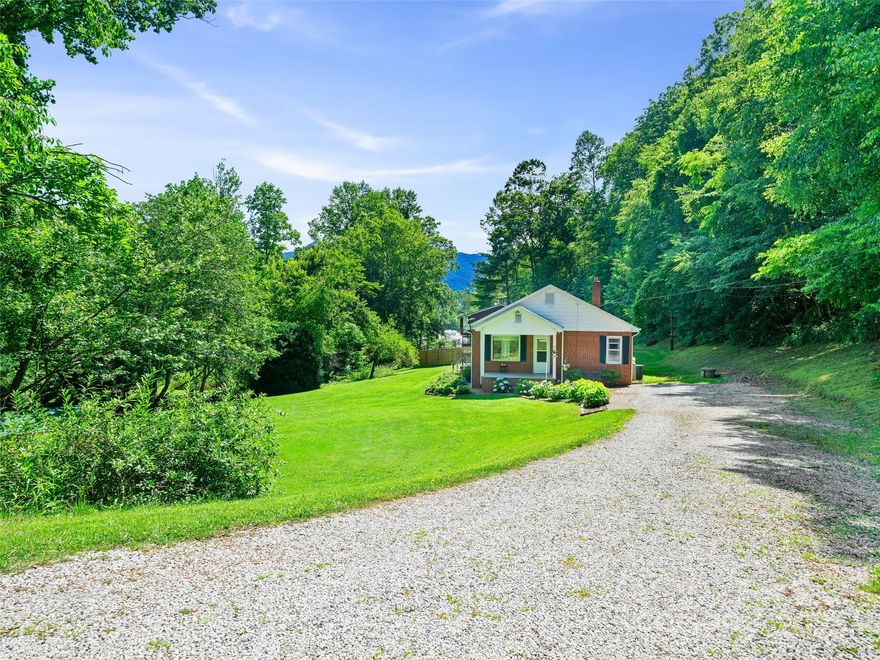 A cozy home surrounded by a beautiful lawn and a creek is just what you have been looking for. Conveniently located between Spruce Pine and Bakersville and just a short distance from the county's elementary, middle and high schools. The home interior offers 2 bedrooms but the laundry room could be converted back to its original purpose if an extra bedroom is needed. Arched entryways and hardwood floors are classic features, with built-in shelving for added character. Outdoor pleasure awaits with a flat lawn, covered porches and deck and a location for pets and small farm animals to roam. The large basement has you covered for storage needs and extra appliances if you have them. Parking is a breeze and easy access to the state maintained road assures little maintenance year round. With central heat and air offering year round comfort, what’s not to love?