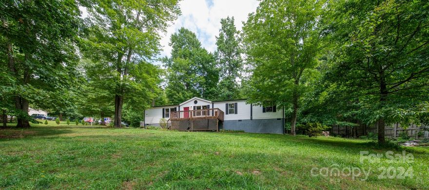 Nestled in the sought-after location of Avery's Creek, this newly renovated three-bedroom, three-bathroom double-wide home sits on a spacious 0.38-acre lot. The property offers a perfect blend of modern amenities and charming features, including TWO bonus rooms! The open concept living area boasts ample natural light, creating a warm and inviting atmosphere. The renovated kitchen is equipped with sleek countertops, and plenty of storage space. Each bedroom is generously sized and offers a tranquil retreat. The bathrooms have been tastefully updated with contemporary fixtures and finishes. Outside, the expansive yard provides endless possibilities for outdoor recreation and relaxation. This property is ideal for those seeking a peaceful retreat with modern comforts in a desirable location.