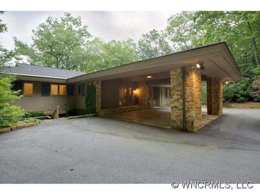 Unique priviacy and spectacular big water views surround this combined lot estate property spread over three acres. Extensive natural landscaping thoughout property with paths, a pond and the sound of water. This property is less than one mile to the Lake Toxaway Club, golf course and marina.