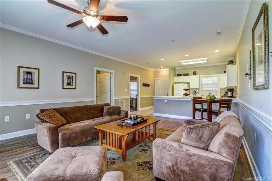 Walk to UNCC! Close to shopping and restaurants. Open floor plan, ground level unit. Covered patio overlooks the pool and a large grass field.  Additional storage room off the patio. Both bedrooms are attached to their own bathrooms and separately keyed; perfect for roommates! Tile flooring in kitchen and bathrooms and laminate wood in great room and bedrooms; no carpet.  Neutral paint throughout. Washer, dryer & refrigerator remain.