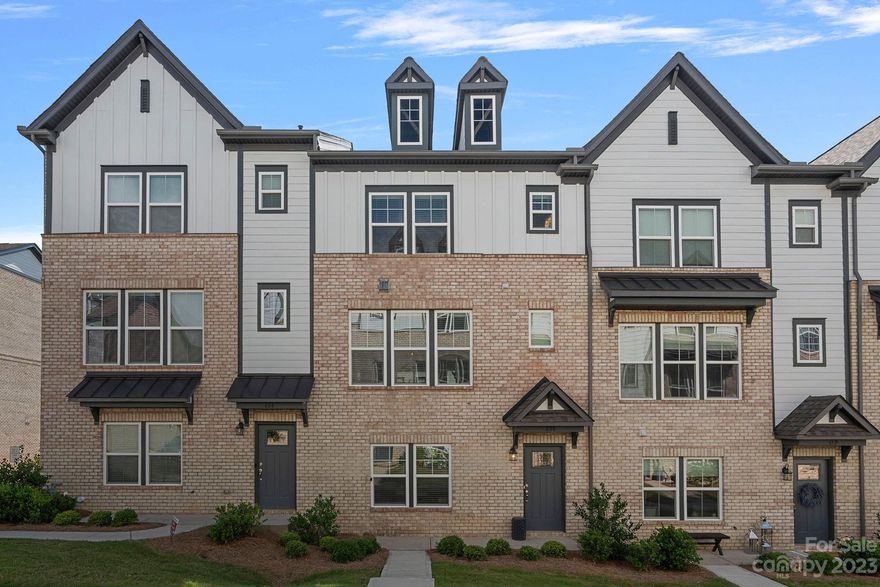 GORGEOUS three-story townhome in the popular Wendwood Terrace neighborhood! The home features a stunning gourmet kitchen with quartz countertops, stainless appliances, 5-burner cooktop, subway tile backsplash, beautiful pendant lighting & large center island perfect for entertaining. The great room is bright and airy with a 43" lineal electric fireplace and 9' multi-slide glass doors leading onto the private balcony. Gorgeous laminate Mohawk 7 1/2' flooring at foyer, garage entry and entire 2nd floor. Primary owner's suite and second primary bedroom located on 3rd floor with walk-in closets & upgraded ensuite baths. Tray ceiling in the primary suite. The main level features a guest suite currently used as an office, a beautiful full bath and access to the rear load 2-car garage. Communal parking for both residents and their guests. The community has a private dog park for residents. Exceptional location close to Uptown, SouthPark, the Briar Creek Greenway & fabulous shopping & dining!