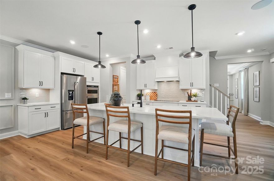 New Luxury Brick townhome in prime Ballantyne residential location!  The Caswell End floor plan is spacious, functional and well appointed. Upon entering, you notice elegant features in the foyer including a Tray Ceiling and ext. Millwork. The large open living area features wide plank flooring, a Gourmet Kitchen with huge island, Kit.Aid appliances, 42" White cabinets w/soft close, pull out shelves,
under cab. lights, Farmhouse sink, and Quartz.  4 bed/3.5 bath including 2 Lg. Primary Suites w/ sitting areas, en suite baths w/ tiled shower, and 2 walk in closets in 2nd floor Primary!  The home is filled with light from an abundance of recessed lights and beautiful trimmed windows.  9 ft. ceilings, 8' doors on 1st and 2nd level, Crown Molding and 2" faux wood blinds throughout the home are a few of the upgrades that enhance this home.

One of 28 homes in our exclusive boutique community.

Ask about financing incentives offered with our preferred lender!