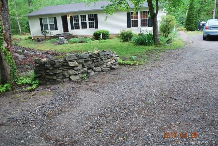 Nebo area-3 bedroom, 2 bath vinyl sided Ranell, t-pane windows, masonry underpinning, ceramic tile baths, living room w- fireplace, heat pump and more.  The property has a pond with trout & catfish for your outside enjoyment.  The property also has an additional septic tank on the property.  Also the property is considered Nebo, it is in Glenwood school district.