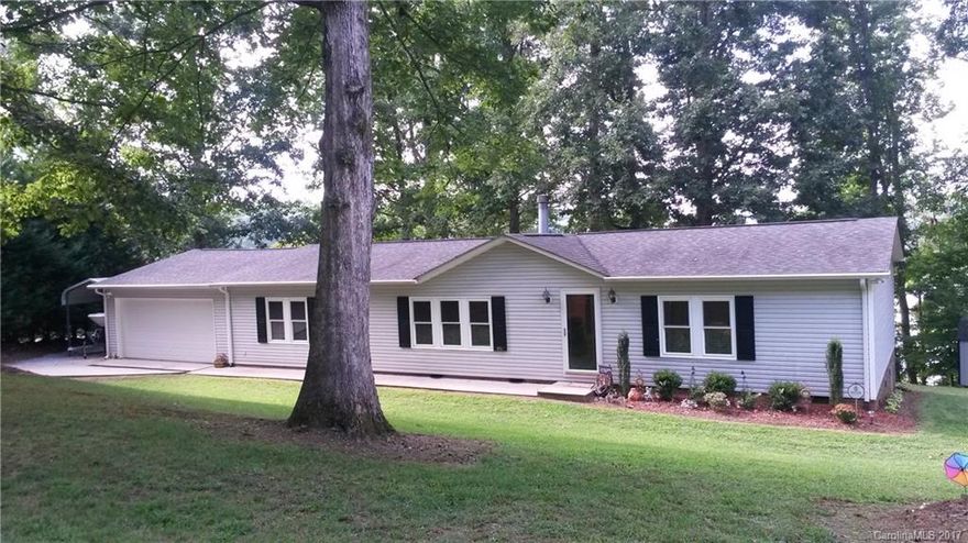 Tranquil waterfront setting, gorgeous sunset views, immaculately maintained home, freshly painted interior, new Champion windows and patio doors, beautifully landscaped yard, great schools. A rare find for a primary residence or a weekend retreat with 140 ft waterfront. Stationary lakeside deck. Even rainy days are nice on the screened porch.Interior is spacious and features split floor plan. Propane tank lease is paid through 12/31/17.