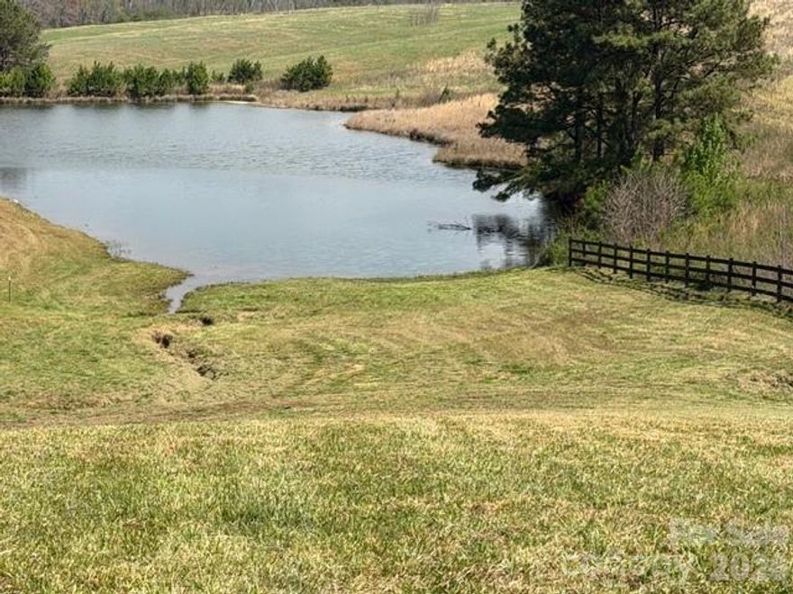 3.49 ACRES OF COUNTRY LIVING, JOINING A POND.
Escape to serenity on this sprawling 3.49-acre property nestled in the heart of the countryside joining and overlooking a charming pond. Surrounded by picturesque landscapes and neighboring larger acreage tracts, this idyllic retreat offers the perfect blend of privacy and community. Embrace the tranquility of rural living while being just a stone's throw away from the beauty of nature and the charm of farming life. Don't miss this opportunity to own your slice of country paradise! This property has road frontage on Lamb's Grill Road. It is approx 6.2 miles to Chesnee, SC and approx 18 miles to Forest City NC and Spartanburg SC. It is conveniently located approx 13 miles from the Tryon International Equestrian Center and approx 3.1 miles to Strawberry Hill.