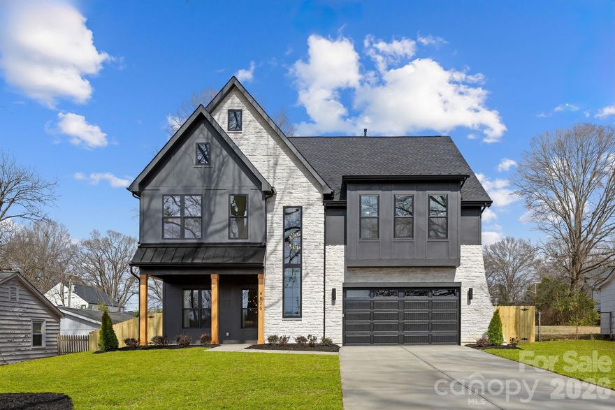 Stunning single family new build by KO Construction in vibrant Oakhurst, just minutes to Plaza Midwood, Cotswold and Uptown Charlotte. Step inside to an inviting open-concept floor plan graced by soaring 10-foot ceilings, abundant natural light, and elevated designer finishes throughout. Custom details abound, including shiplap-accented ceilings in the primary suite, intricate wall trim, elegant crown molding, and sophisticated lighting fixtures that elevate every room. The spacious great room impresses with custom built-in shelving featuring a cozy gas fireplace - ideal for gatherings year-round. A versatile main-level guest bedroom (or home office) with its own full bath offers privacy and convenience. Upstairs, retreat to a grand primary suite that’s a true showstopper: flooded with light, featuring a trey ceiling, expansive walk-in closet, and a spa-like en-suite bath with premium selections. Three additional bedrooms provide comfort, including two with private ensuite baths meticulously crafted with high-end designer touches. A large loft space serves as a flexible bonus area—perfect for a home office, playroom, media lounge, or gym. Outside, relax on the covered rear balcony overlooking a spacious, private backyard with a refurbished storage shed. This functional, modern layout combines timeless craftsmanship with contemporary style in one of Charlotte’s most sought-after intown locations. Minutes from the eclectic shops, restaurants, and nightlife of Plaza Midwood and Cotswold Village, with quick access to Uptown Charlotte via Independence Boulevard. Don’t miss this rare opportunity to own new construction on a third of an acre in an established, tree-lined neighborhood with charming appeal; all within a short drive to Cotswold Village shopping center.