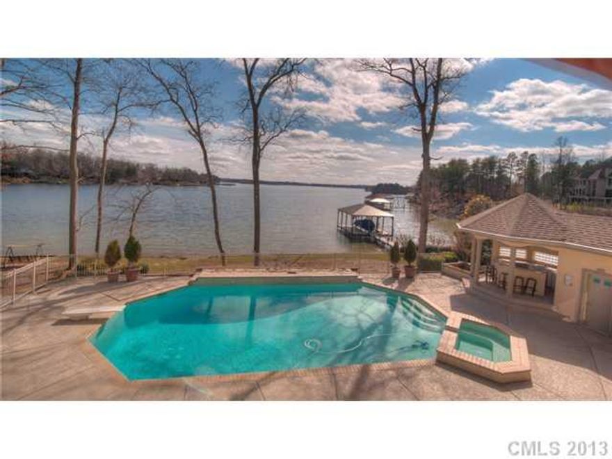 Custom waterfront home w/350' shoreline, Pool/Hot tub, private covered boat slip. Gourmet kit & entertainment/bar open to rec rm  & GR w/ gas FP & vaulted ceilings. Mstr suite & guest bdrm on main lvl take elevator to LLvl w/3 addt'l bdrms, 2nd kit & laundry, rec rm. Addt'l features:8-car drive thru garage, steam rm, central vac, invisible fence, cedar closet, smart sound system & much more.