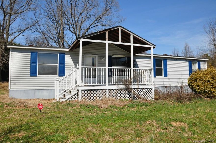 3 bedroom and 2 bath double-wide on a nice lot measuring just over an acre.  Front porch and rear deck for relaxing.  Nice country setting, yet not far from town.  This is not a foreclosure, but an estate.  Priced to sell!  Bring any offer.  Brand new refrigerator to installed 03/14/15!  All new blinds.