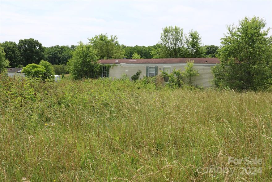 Over a half acre lot in an established neighborhood in Fallston/Lawndale.  Being sold as a lot only with no representation to the manufactured home that is currently on the property.  Home has been vacant for years please do not enter property.  Per seller there is a septic on the property.  County water services this neighborhood.