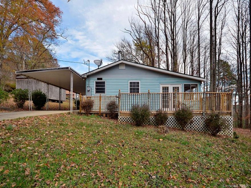 Cute home with a large deck off the front of this home.  This home offers 2 bedrooms with a 3 bedroom septic for expansion and an updated kitchen.  Separate laundry room and 2 sizeable bedrooms and updated bathroom.  A few more finishing touches to make this your getaway place or a vacation rental would work here as well.  Located between Mills River in Henderson County and Brevard.  Check it out soon.